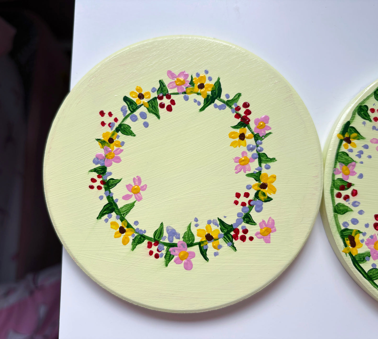 Pastel wildlife coasters, with hand painted wild flowers and a clay ladybug.