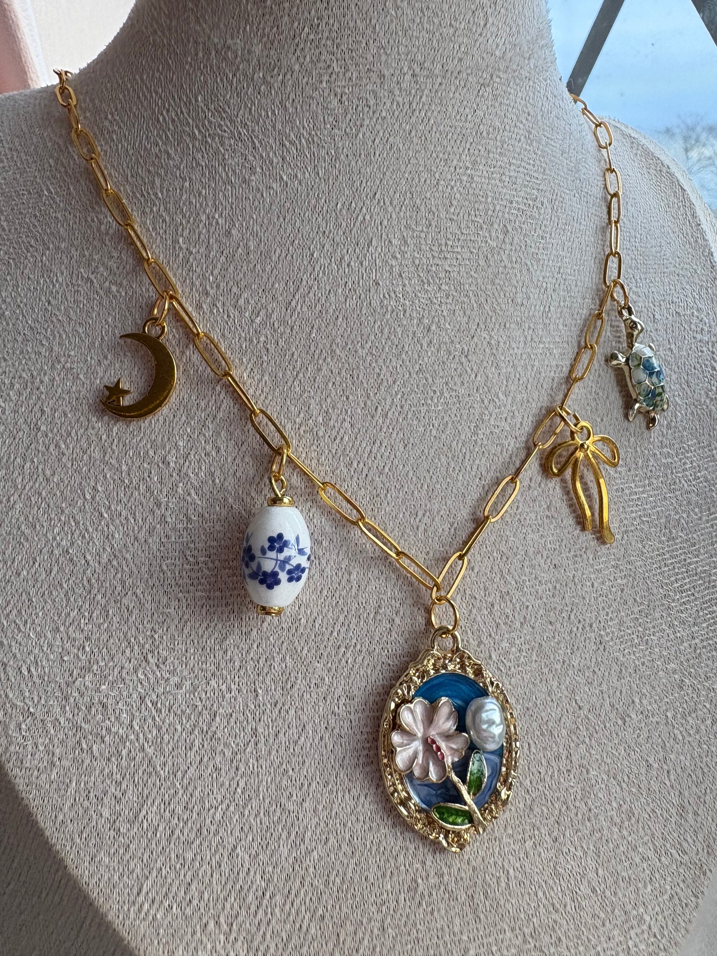 Blue and gold charm necklace