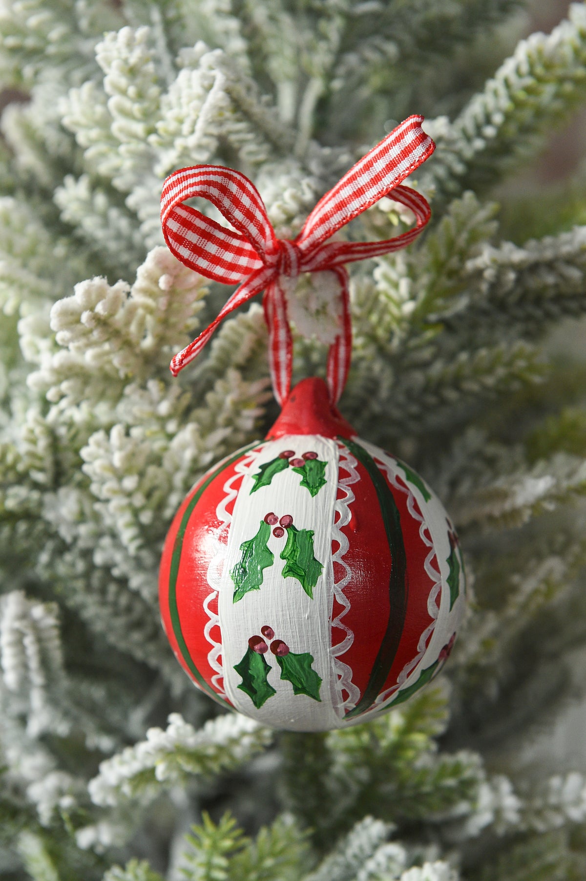 Set of three hand painted christmas baubles in pink, blue and red
