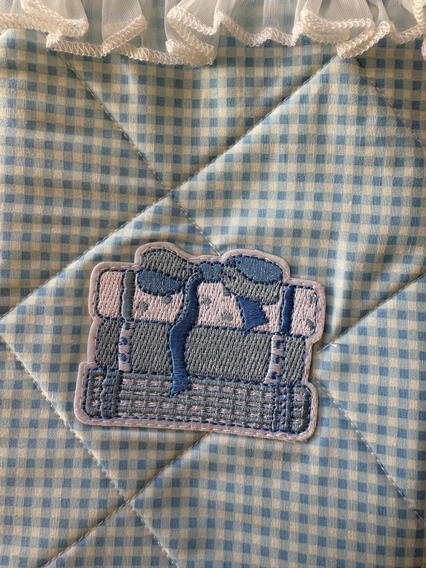 Blue and white gingham quilted kindle sleeve handmade with book appliqué