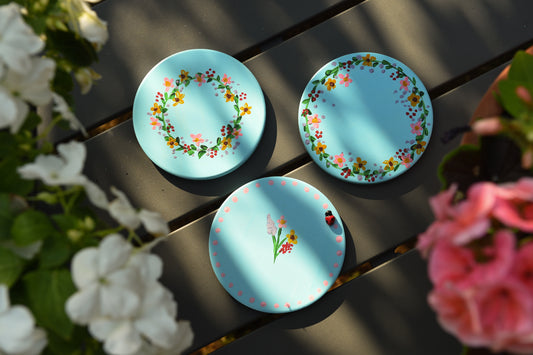 Pastel wildlife coasters, with hand painted wild flowers and a clay ladybug.