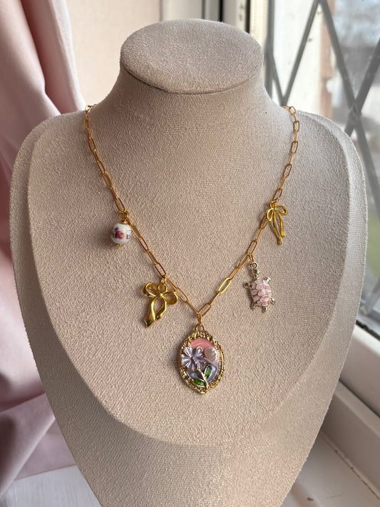 Pink and gold charm necklace