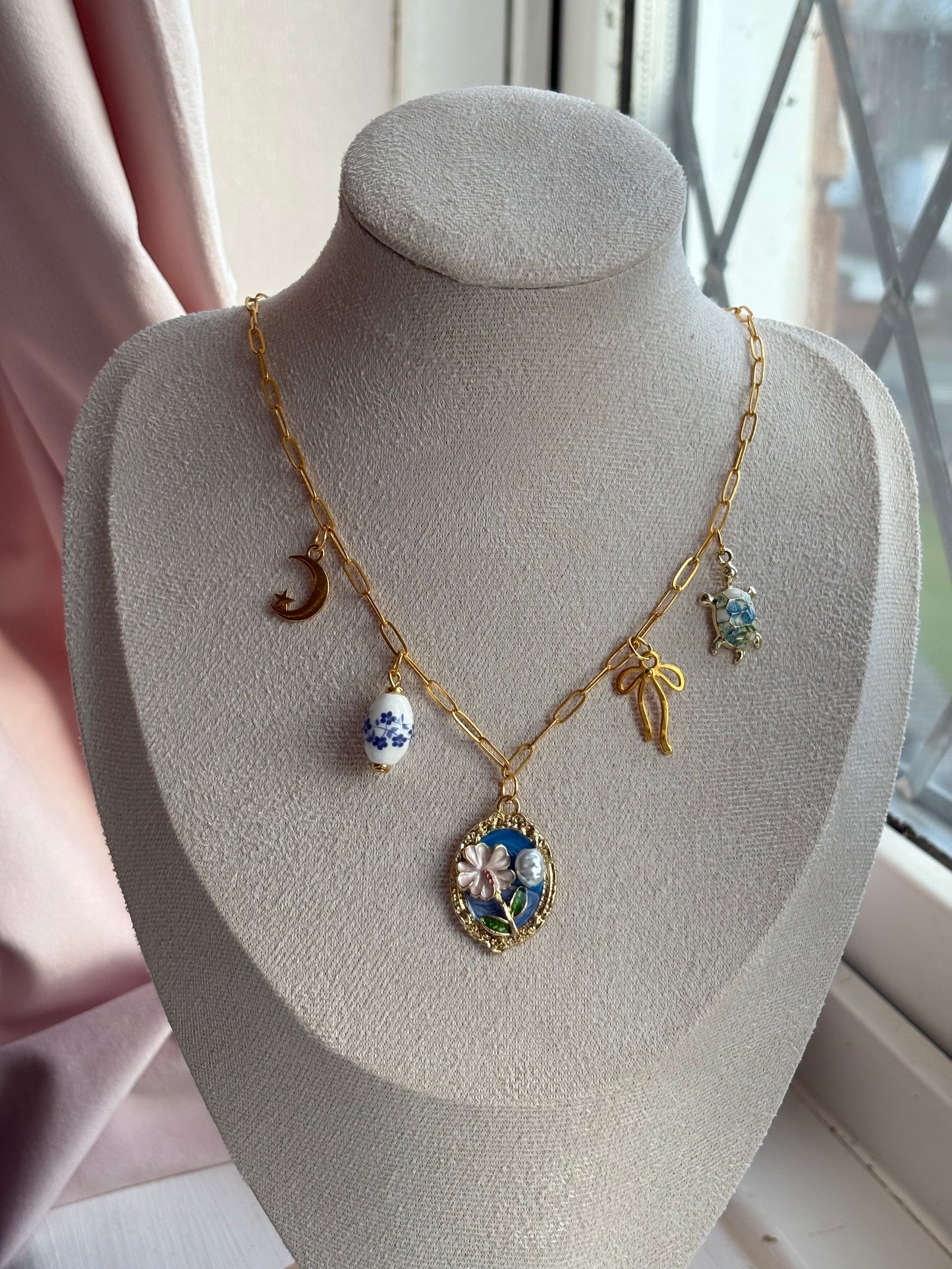 Blue and gold charm necklace
