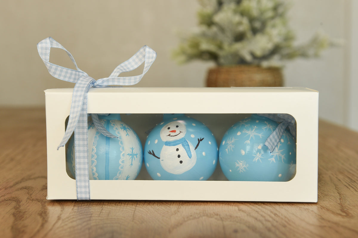 Set of three hand painted christmas baubles in pink, blue and red
