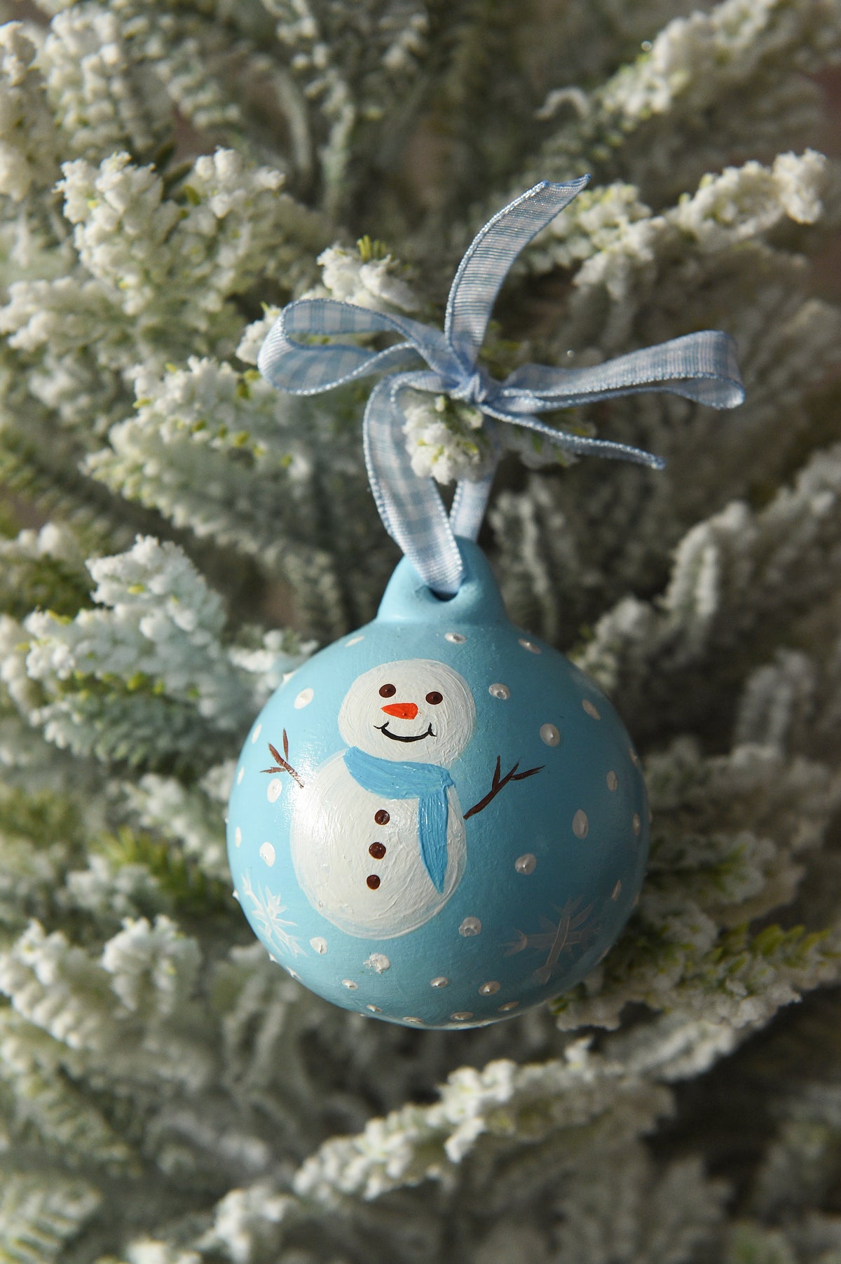 Set of three hand painted christmas baubles in pink, blue and red