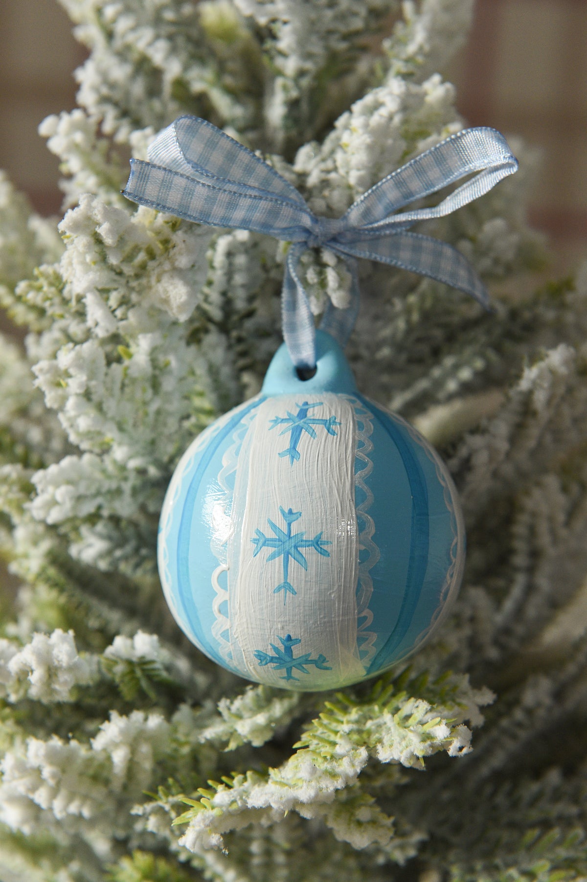 Set of three hand painted christmas baubles in pink, blue and red