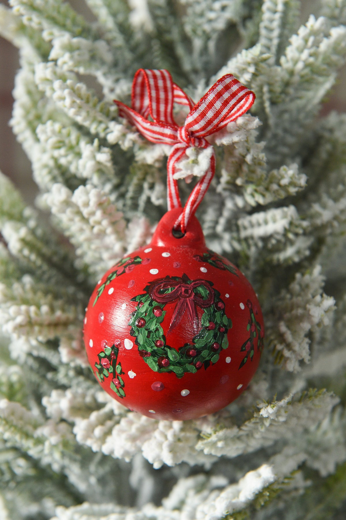 Set of three hand painted christmas baubles in pink, blue and red