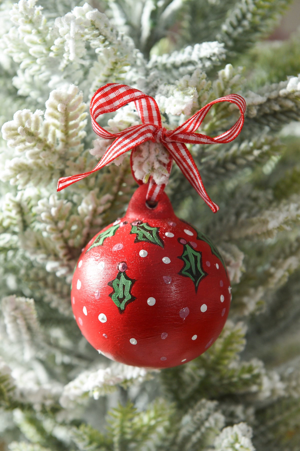 Set of three hand painted christmas baubles in pink, blue and red